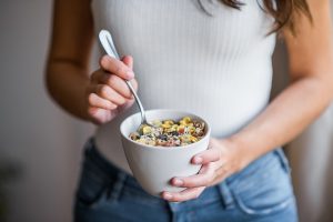 Woman Eating Bowl of Dietitian-Approved Health Foods | Vitacost.com/Blog