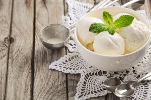 Scoops of Ice Cream with Mint in White Bowl on Wood | Vitacost Blog