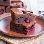 Closeup of Brownie with Cherries on Brown Plate | Vitacost Blog