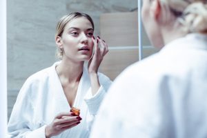 Woman Getting Rid of Dark Circles Under Eyes | Vitacost.com/blog