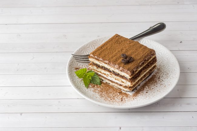 Tiramisu on White Plate Off-Centered on White Wooden Table | Vitacost Blog 