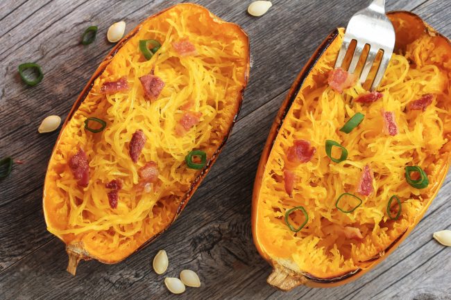 Top View of Spaghetti Squash Boats Garnished with Bacon and Green Onion | Vitacost Blog