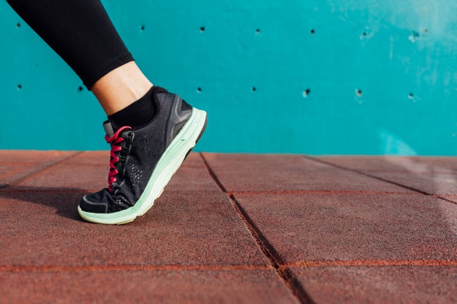Leg and Sneaker View of Person Walking Thousands of Steps per Day to Reach Daily Step Goal | Vitacost.com.blog
