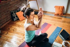 Woman Practicing Yoga at Home Listening to Music | Vitacost.com/Blog