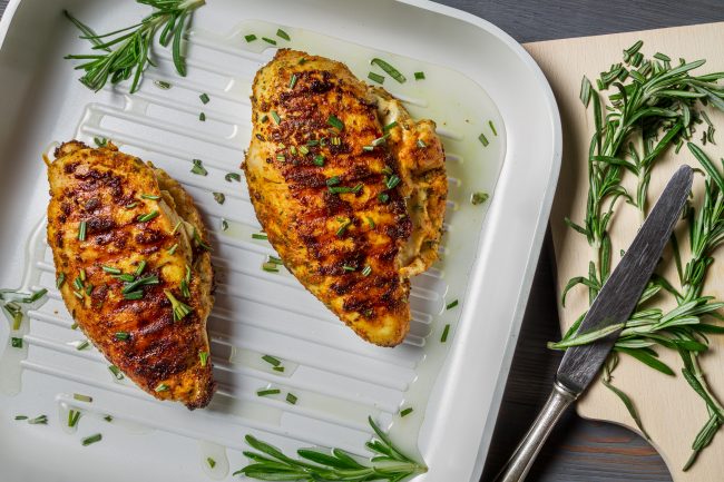 Top View Grilled Chicken and Rosemary on White Plate | Vitacost Blog