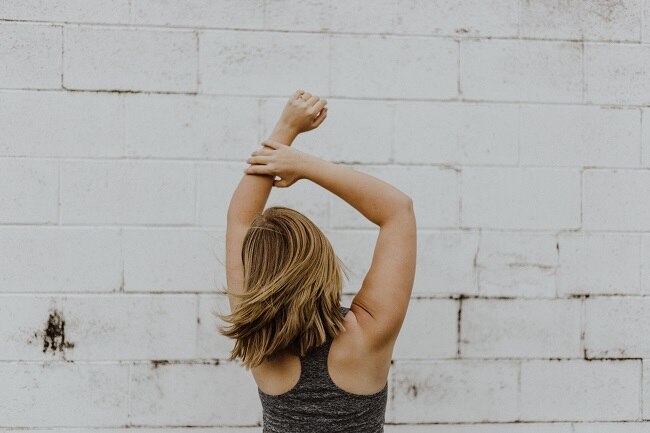DIY Overnight Oil Treatment to Mend Split Ends Woman Who Uses DIY Hair Oil Treatment Showing Off Healthy Hair | Vitacost.com/Blog