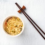 Top View of Bowl of Noodles Next to Chopsticks | Vitacost Blog