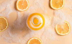 Overhead View of Bottle of Body Wash and Shower Gel Surrounded by Orange Slices and Bubbly Suds | Vitacost.com/blog