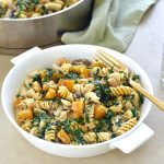 Butternut squash pasta salad in bowl with fork