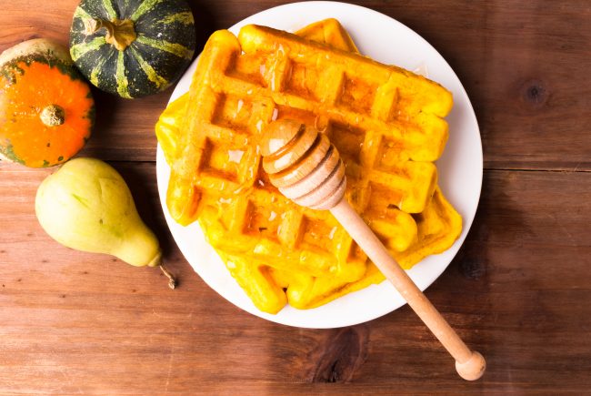Paleo Pumpkin Waffles Top View of Waffles with Honey Dipper | Vitacost Blog