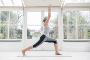 Side View of Woman in Workout Clothing Doing Lunges as Part of Best Exercises for Overall Health | Vitacost.com/blog
