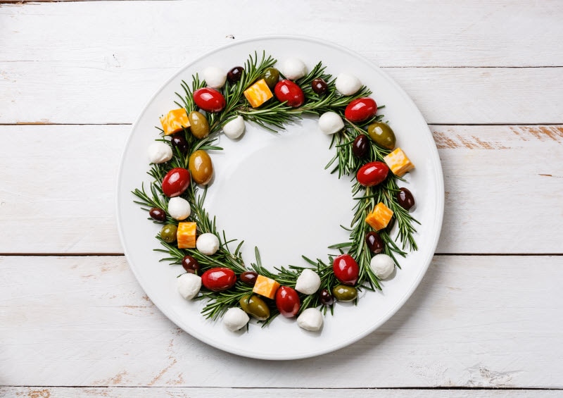 Appetizer Wreath Made From Olives, Tomatoes and Cheese Cubes as Example of Creative Rosemary Uses for the Holidays | Vitacost.com/blog