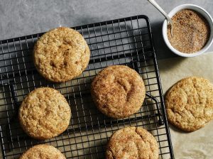 Freshly baked snickerdoodle cookies with bowl of Gustus Vitae Snickerdoodle Cane Sugar