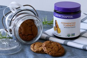 Gingersnap Cooking Spilling Out of Jar Next to Container of New Chapter Fermented Turmeric | Vitacost Blog