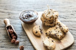 Chocolate Chip Cookies Stuffed with Chocolate Sauce on Cutting Board | Vitacost Blog