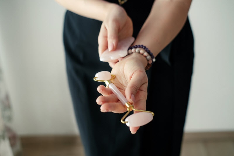 Torso View of Woman Holding Jade Roller as Valentine Day Gift Idea for Someone Interested in Healthy Living | Vitacost.com/blog
