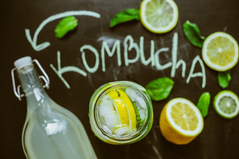 Overhead View of Jars of Kombucha with Lemons as Example of Trending Health Foods and Practices | Vitacost.com/blog