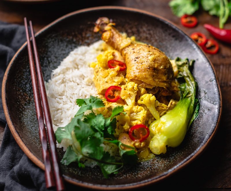 Smoked Chicken Curry with Baby Bok Choy Close Up of Curried Chicken and Bok Choy Next to White Rice