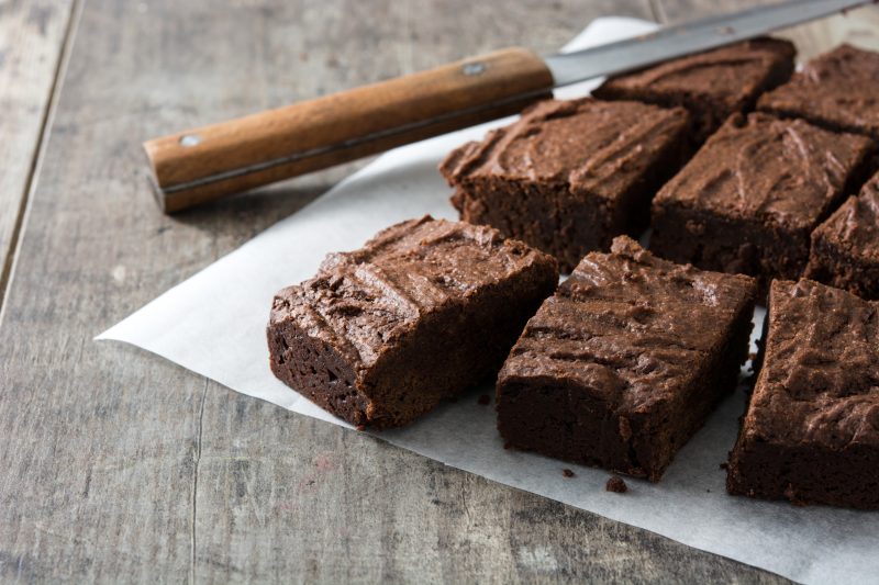 Close Up of Dense Brownies on Wax Paper | Vitacost Blog