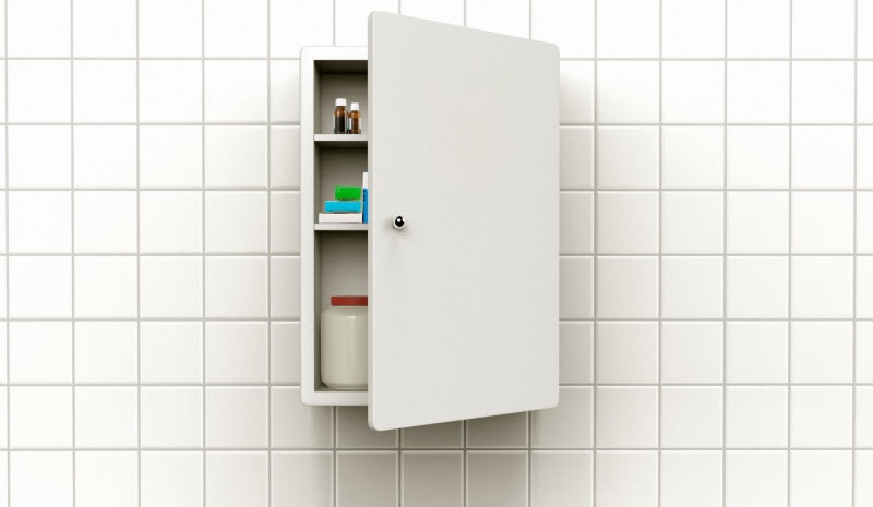 Expired Supplements Lurking in Medicine Cabinet Attached to White Tile Bathroom Wall | Vitacost.com/blog