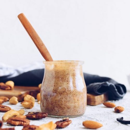 Nut Butter in Clear Jar Surrounded by Loose Nuts | Vitacost Blog