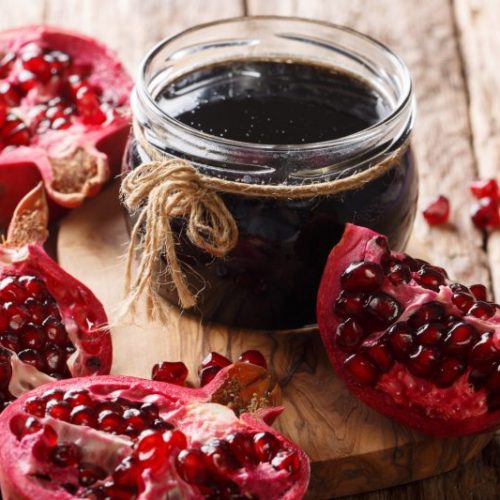 Pomegrante Jam in Small Jar Next to Open Pomegrantes | Vitacost Blog