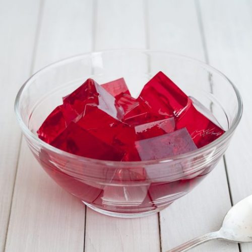 Red Gel Cubes in Glass Bowl on White Wood | Vitacost Blog