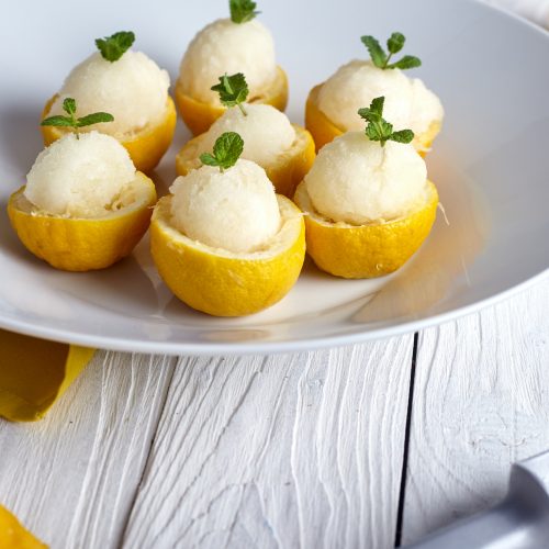 Frozen Yogurt Balls in Lemon Halves on Plate | Vitacost Blog