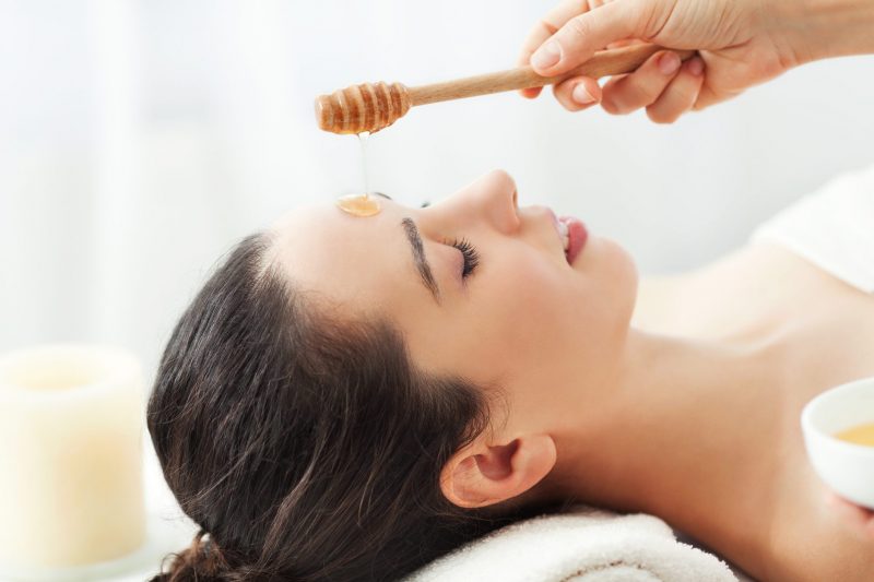 Honey Being Drizzled Onto Woman's Forehead | Vitacost Blog