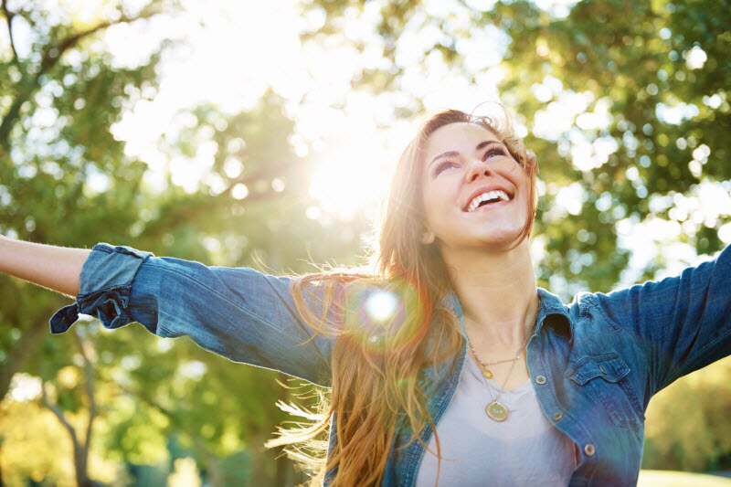 Woman Embracing Her Natural Beauty Happily Enjoying Herself Outdoors | Vitacost.com/blog