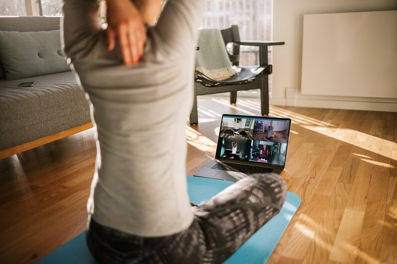 Woman Taking a Live-Stream Yoga Class at Home | Vitacost.com/Blog