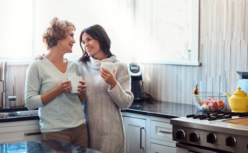 Daughter and Mother Having Conversation in Kitchen About Healthy Boundaries | Vitacost.com/blog