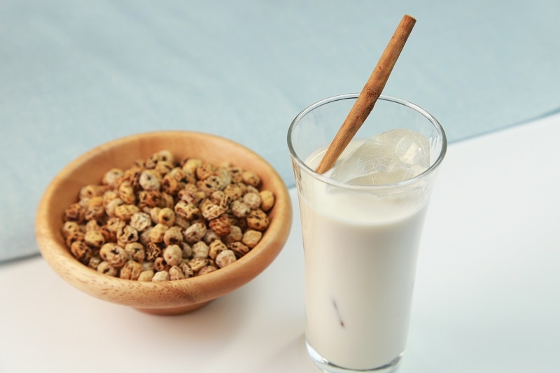 Bowl of Tigernuts Next to Glass of Tigernut Milk | Vitacost.com/Blog