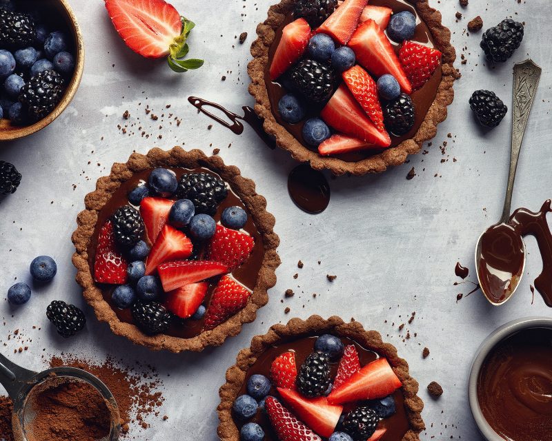 Top View Chocolate Tarts Topped with Fresh Berries | Vitacost Blog