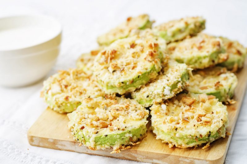 Close Up of Baked Zucchini Chips on Wooden Board | Vitacost Blog