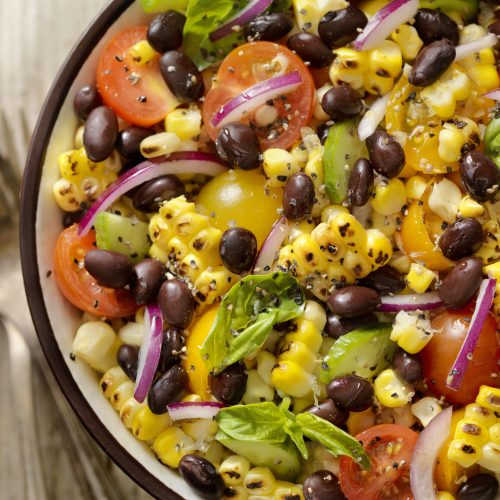 Close Up of Grilled Corn Salad with Black Beans, Lettuce and Tomatoes | Vitacost Blog
