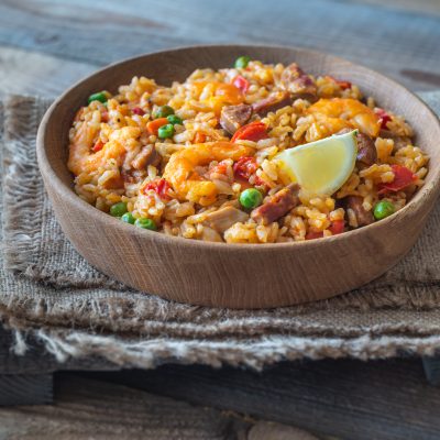 Wooden Bowl of Shrimp Paella on Cloth Napkin | Vitacost Blog