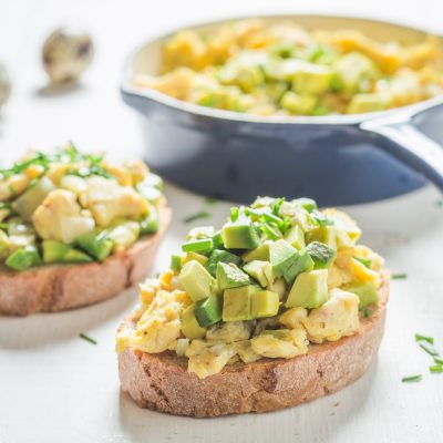 Two Slices of Toast Topped with Tofu Scramble and Avocado | Vitacost Blog