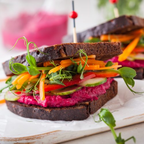 Two Sandwiches Loaded with Greens, Carrots and Beet Hummus | Vitacost Blog