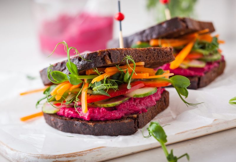 Two Sandwiches Loaded with Greens, Carrots and Beet Hummus | Vitacost Blog