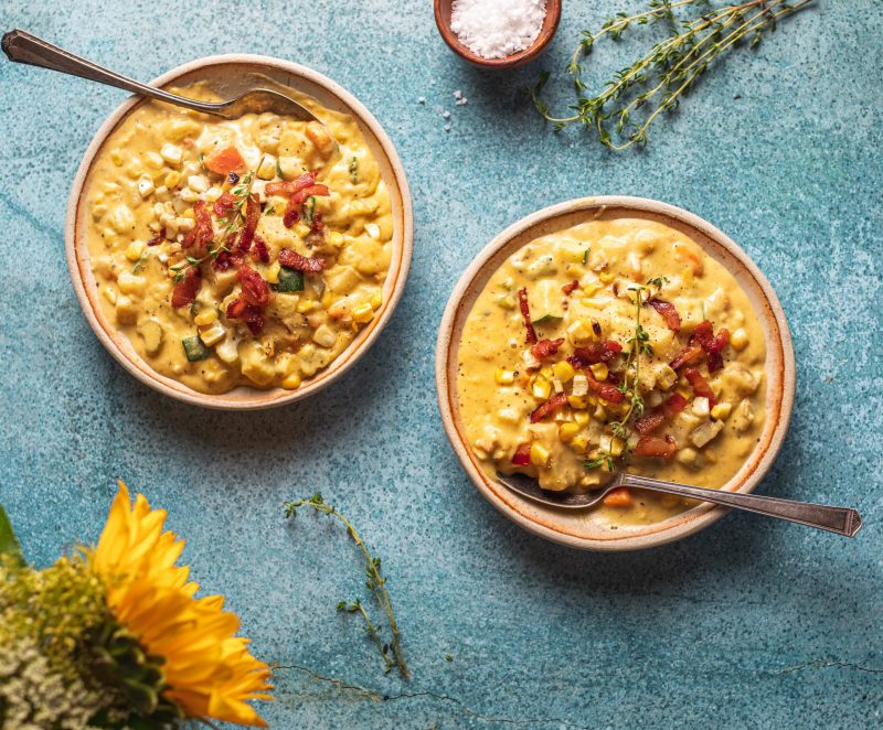 Top View Two Loaded Bowls of Corn Chowder on Gray Table | Vitacost Blog