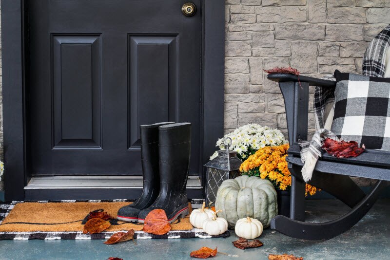 Getting Your Home Ready for Fall Front Porch Setting with Pumpkins and Boots to Represent Getting Your Home Ready for Fall | Vitacost.com/blog