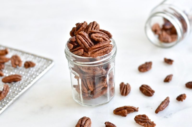 Glass Jar Overflowing with Pecans | Vitacost Blog