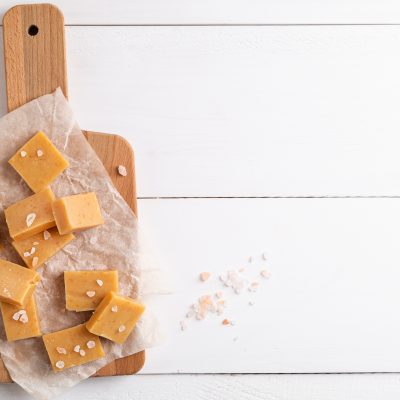 Top View Salted Maple Sugar Candies on Wooden Board over White Background | Vitacost Blog