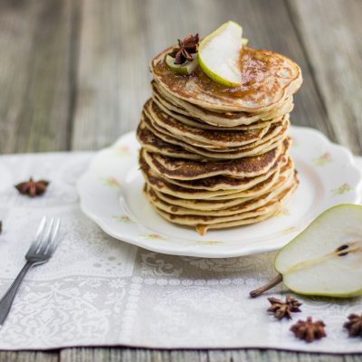 Tall Stack of Pancakes Garnished with Slice of Pear Next to Halves Pear | Vitacost Blog