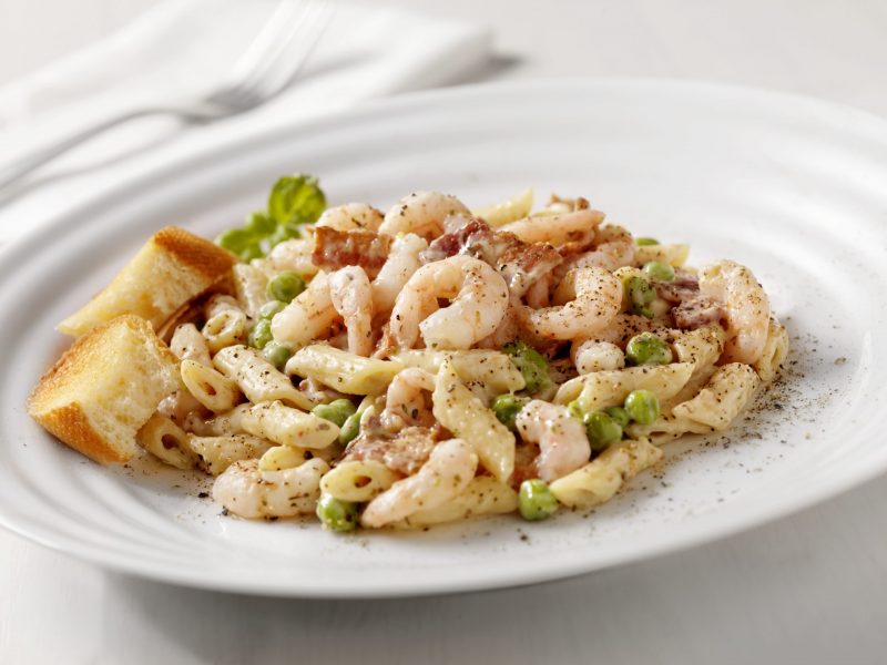 Creamy Shrimp Carbonara with Peas and Bacon on White Plate | Vitacost Blog
