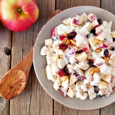 Top View Cranberry, Apple Salad Next to Wooden Spoon and Fresh Apples | Vitacost Blog