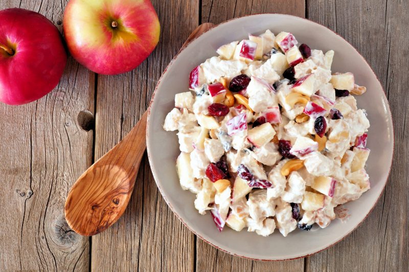 Top View Cranberry, Apple Salad Next to Wooden Spoon and Fresh Apples | Vitacost Blog