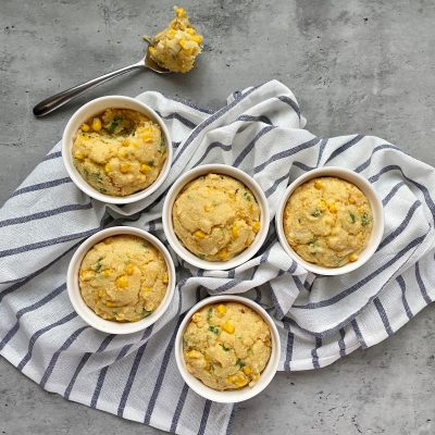 Top View Cornbread Casserole in Ramekins on Grey and White Towel Gray Background | Vitacost Blog