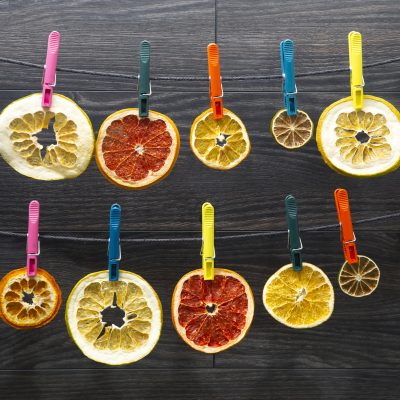 Lines of Dried Citrus Safety Pinned to String | Vitacost Blog